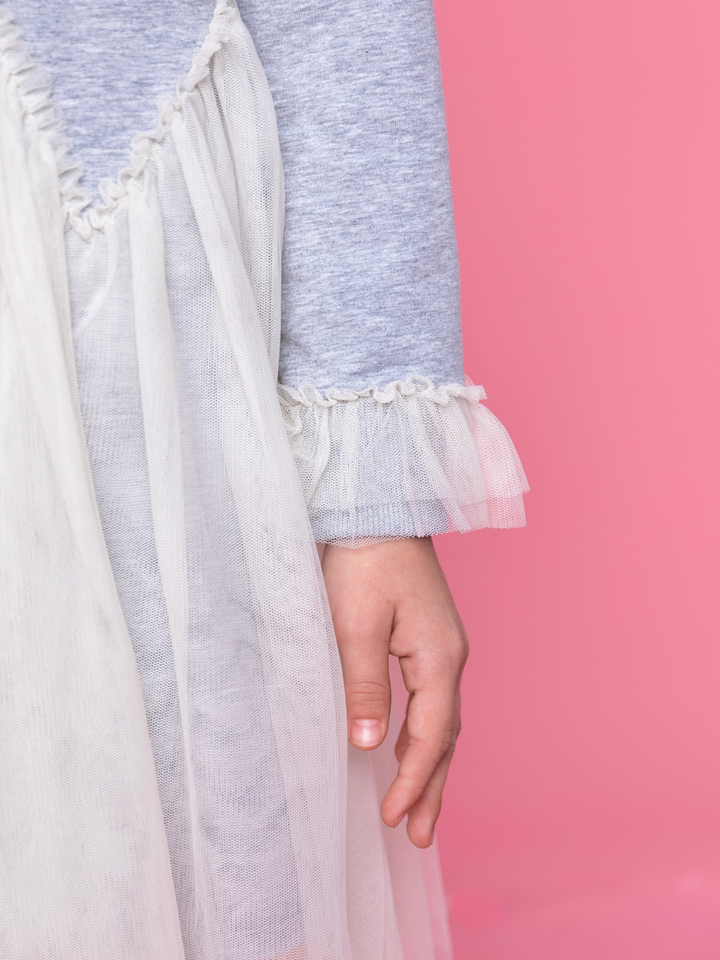 Close up of ruffle trim and delicate tulle overlay