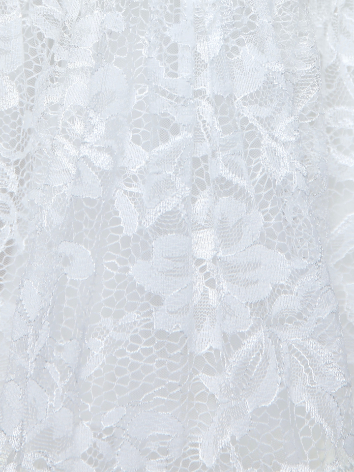 Close up of ivory lace skirt with floral textured pattern