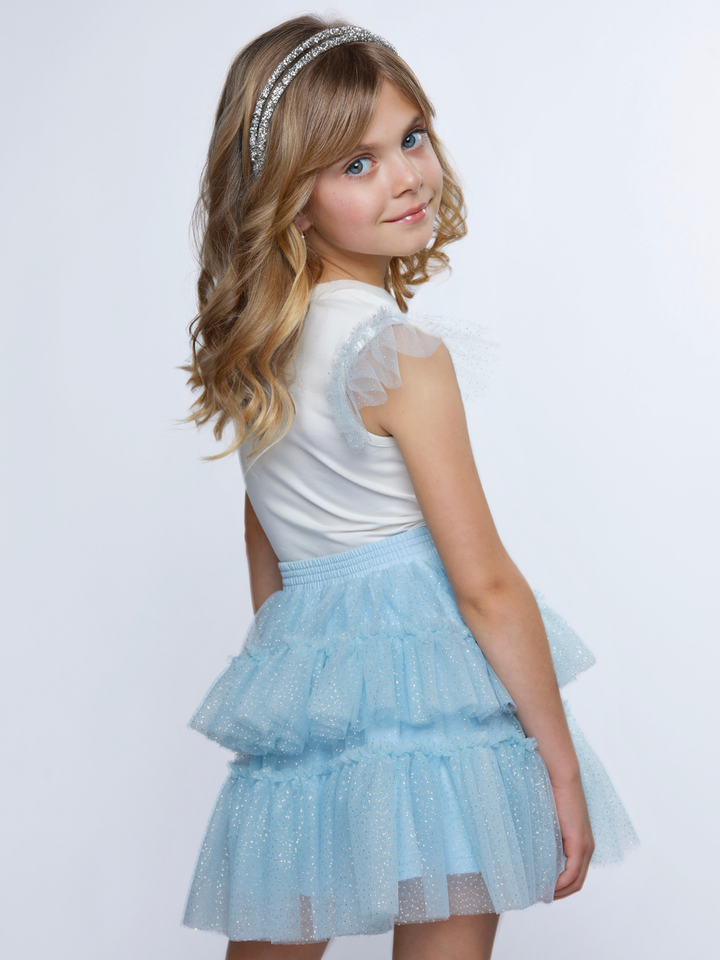 Side view of girls blue tutu skirt set with bow top