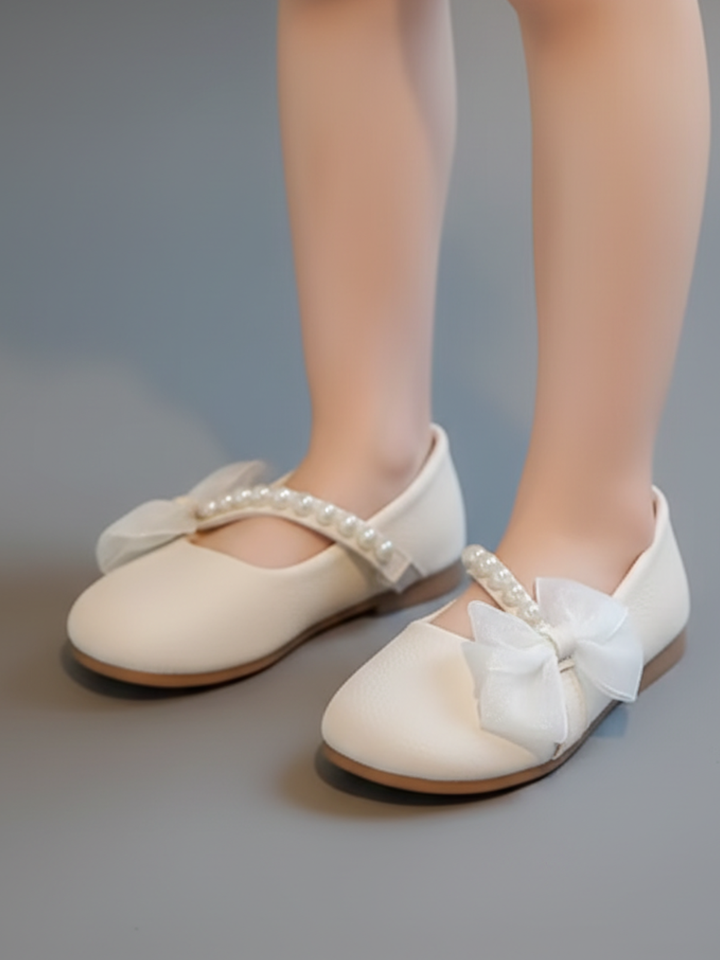 white girls dress flats with pearl strap and bow detail