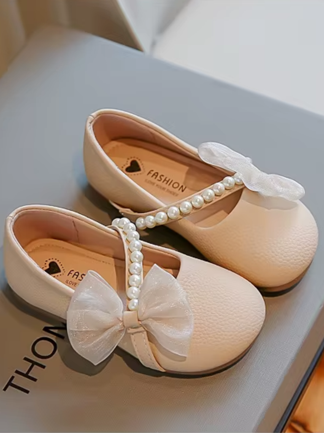 beige girls dress flats with pearl strap and bow detail