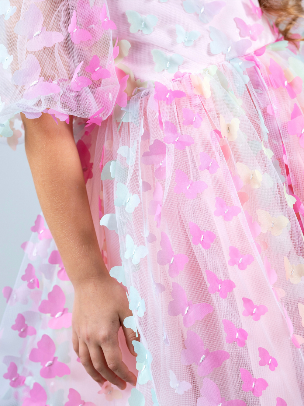 3D butterfly appliqué detail on girls spring party dress