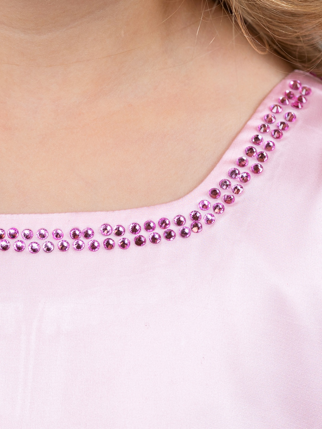 Rounded neckline detail on girls pink Easter dress