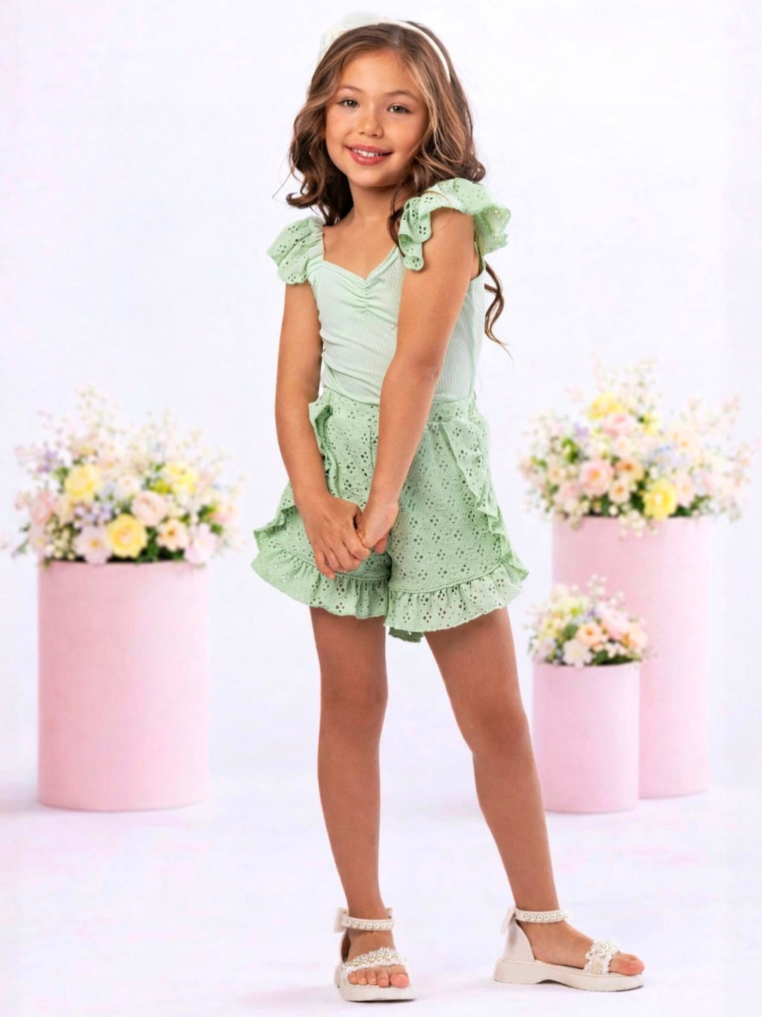 Stylish girls sage green outfit with ruffle sleeves and embroidered eyelet shorts