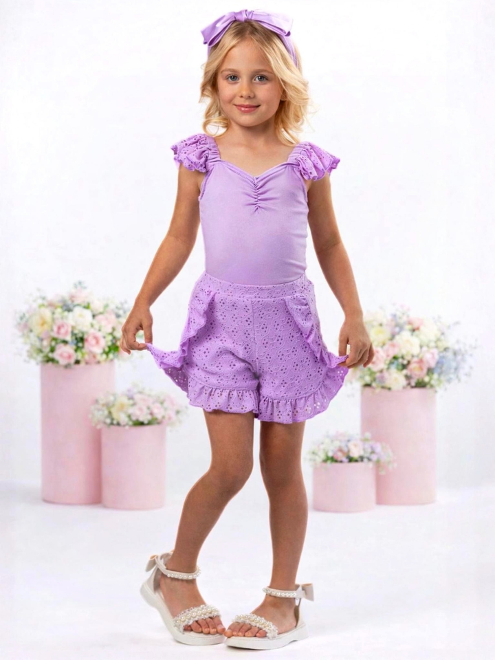 Girl wearing purple eyelet shorts set with ruffle trim for everyday wear