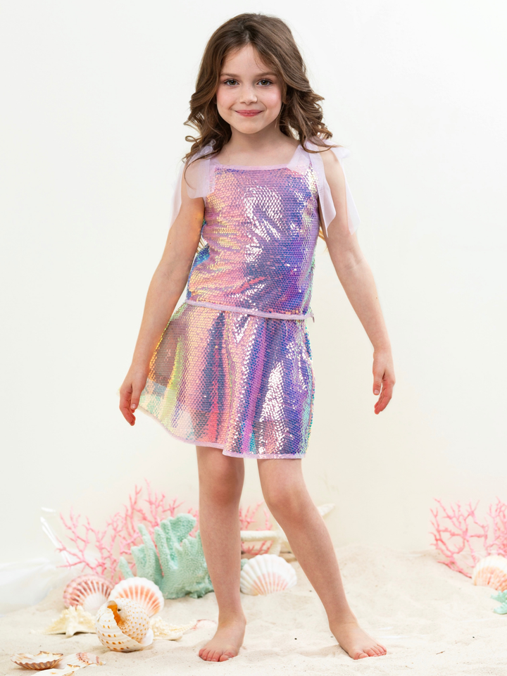Girl wearing iridescent sequin skirt set with shimmer top for party outfit
