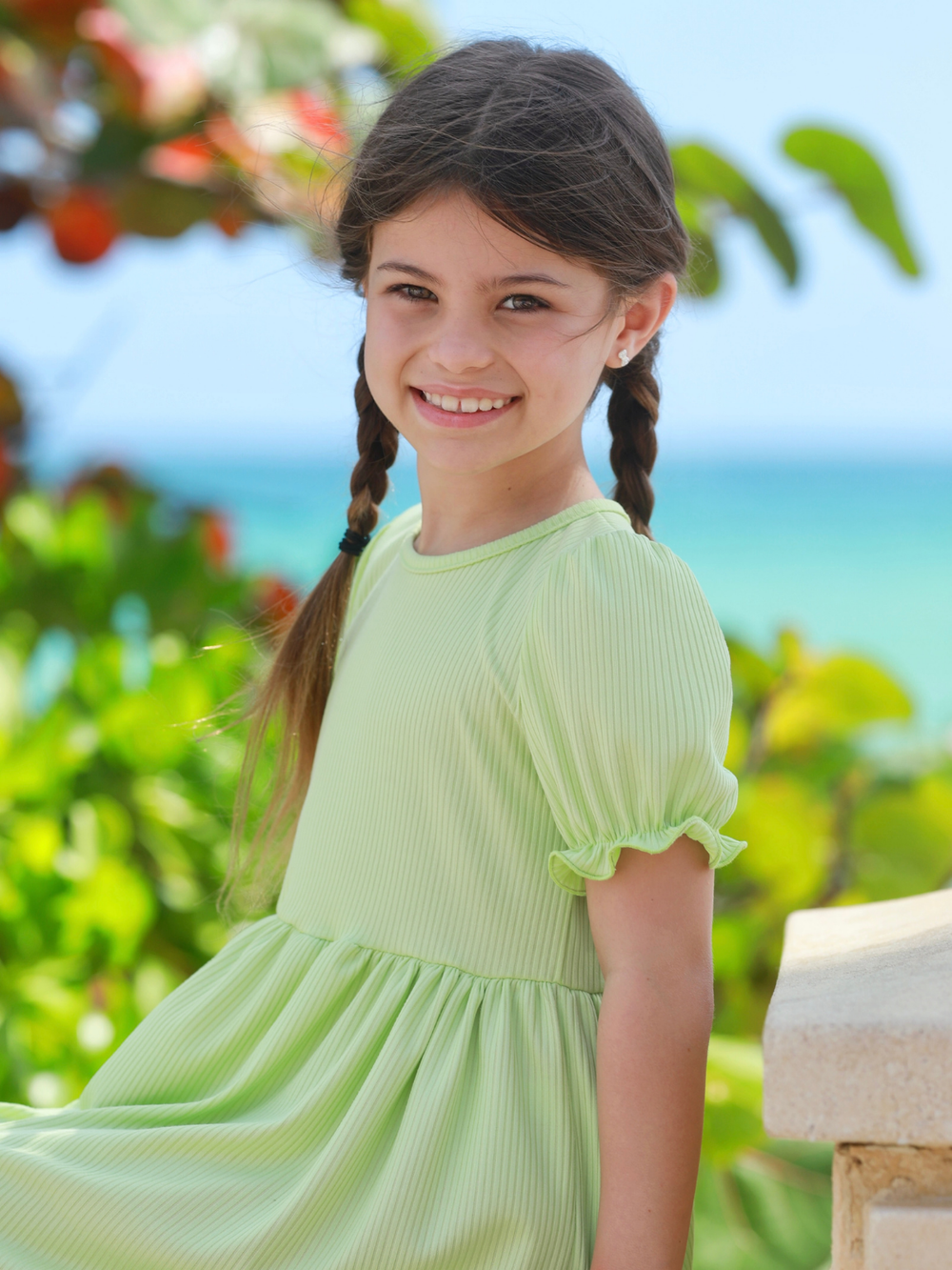 girl wearing lime green summer dress with puff sleeves casual outfit