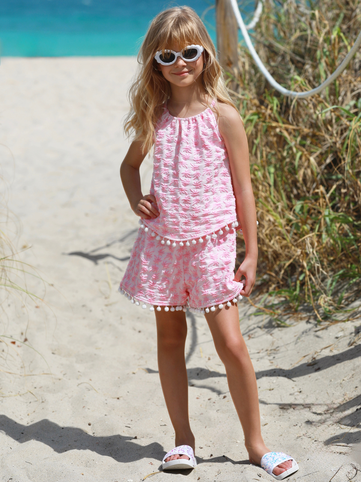 cute girls outfit pink sleeveless top and shorts with pom trim