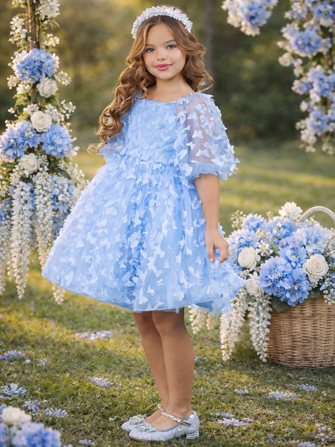 Girls blue butterfly dress styled for spring wedding