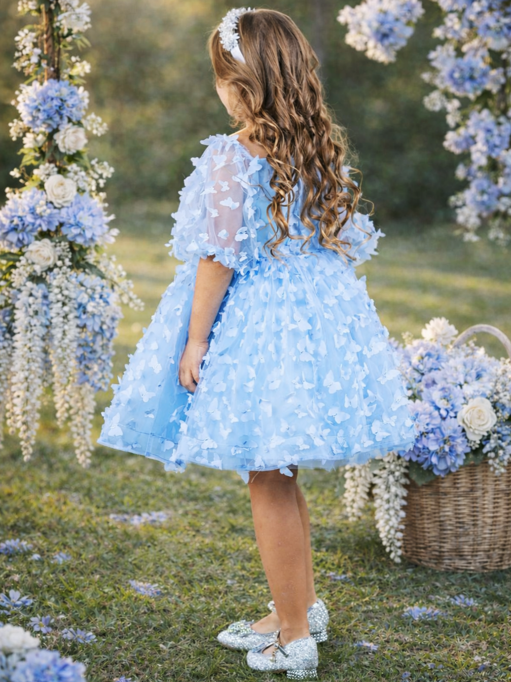 Blue party dress for girls with butterfly appliqué details