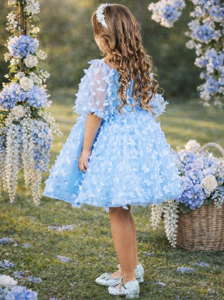 Blue party dress for girls with butterfly appliqué details