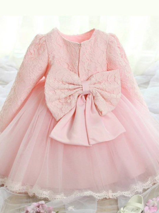 Baby Spring dress has a long-sleeved lace bodice  and layered tulle skirt with a big bow the back