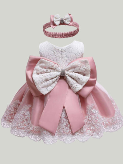 Baby Spring dress has a short-sleeved lace bodice and a skirt with lace hem and a big bow on the back, comes with a matching headband