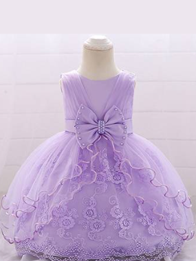 Baby dress has a tulle overlay with a multi-layer skirt, bow detail at the waist-lilac