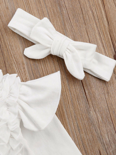 Baby set features a long-sleeved onesie with ruffled shoulders, ruffled leggings, and matching headbands