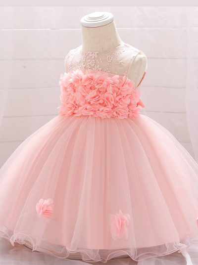 The dress has a bodice with flower applique and tulle skirt