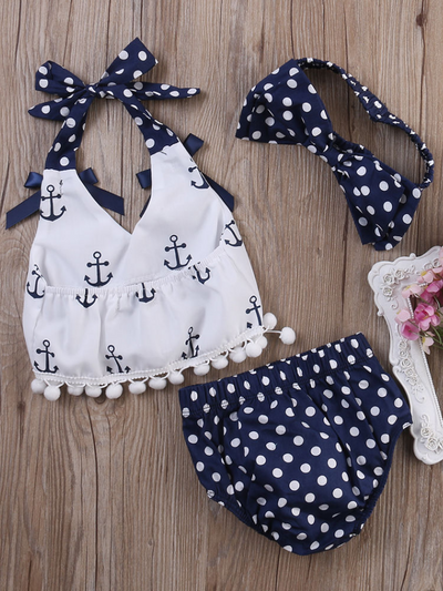 Baby set features a white halter top with an anchor print and adjustable straps with polka dot bloomer shorts