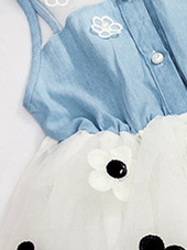 Baby tutu dress has a denim and mesh bodice with front button closure and a tutu skirt with flower applique