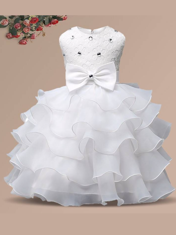 Baby princess dress has a floral lace bodice with rhinestone details, a bow belt at the waist, and a multi-layered tulle skirt