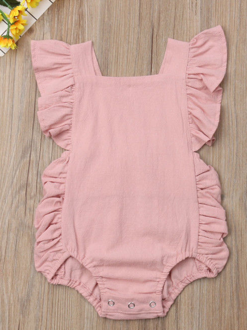 Baby onesie has cute little shoulder ruffles and ruffles on the side. Overall style with strap closure at the back Pink