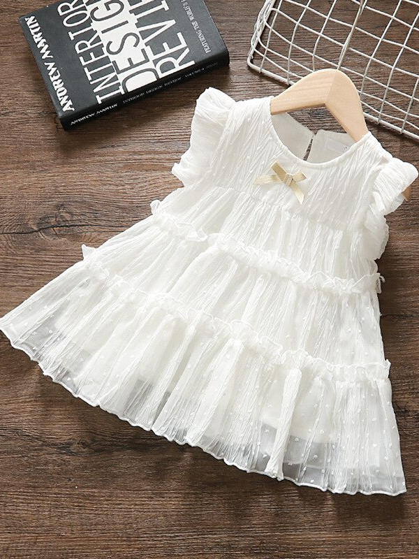 Baby swiss tulle dress has delicate ruffles and a little bow at the front