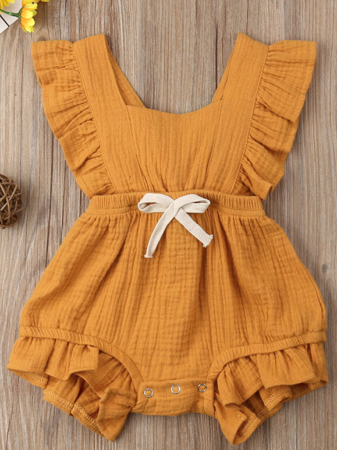Baby bohemian Overall style romper onesie that ties in the back and has a drawstring at the waist. Little ruffled adorn the shoulder and short hem orange