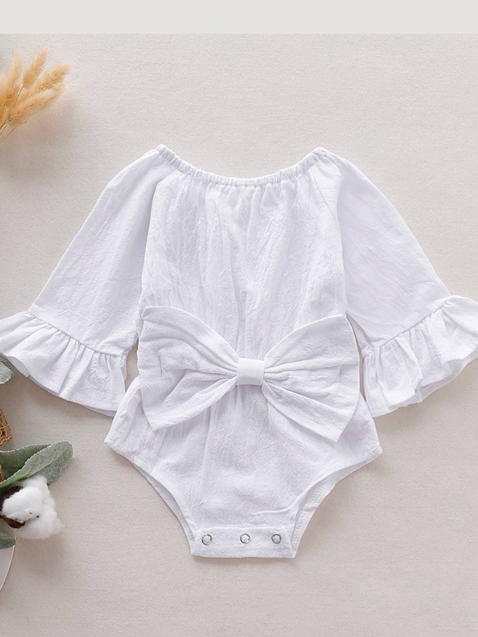 Baby boho style onesie has ruffled long sleeves and a cute bow at the front