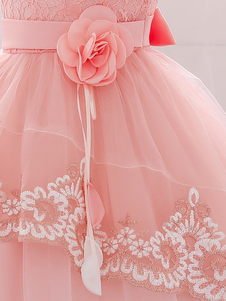 Baby dress has embroidered tulle overlay bodice and hi-lo tulle overlay skirt, removable big bow accent at the back and flower applique at the front
