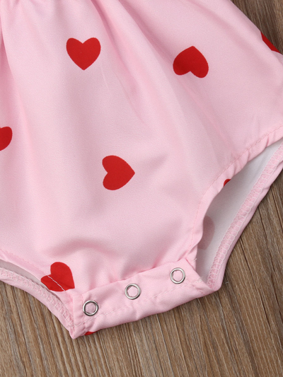 Baby onesie with ruffled short sleeves and a cute collar. Front button and elastic waist. pink with red heart  snap at the bottom 