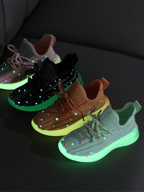 girls sneakers have glow in the dark dots sprinkled all over over and glow in the dark soles