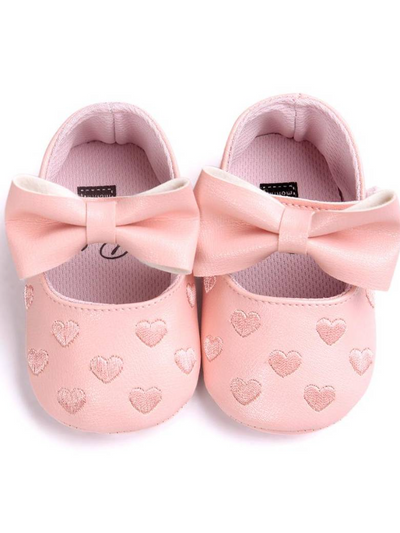 Baby set features a onesie with a tulle skirt, matching shoes, and cap