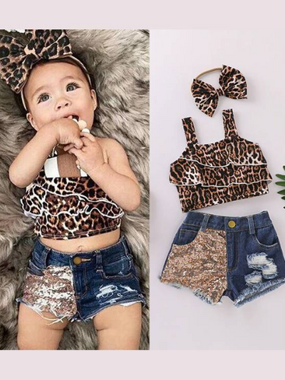 Baby set features a ruffled cropped top with leopard print and distressed denim shorts with sequin patch, comes with a matching headband