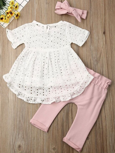 Baby set features an eyelet hi-lo tunic and belted leggings