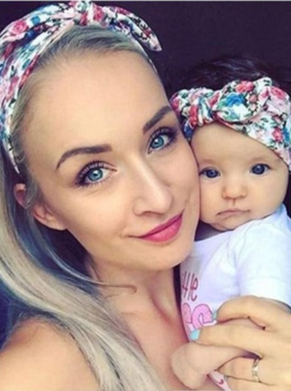 Mommy and baby wearing matching headbands