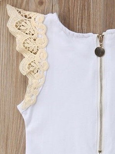 Baby set features a short-sleeved onesie with a crochet ruffle at the shoulder and embroidered shorts with a sash