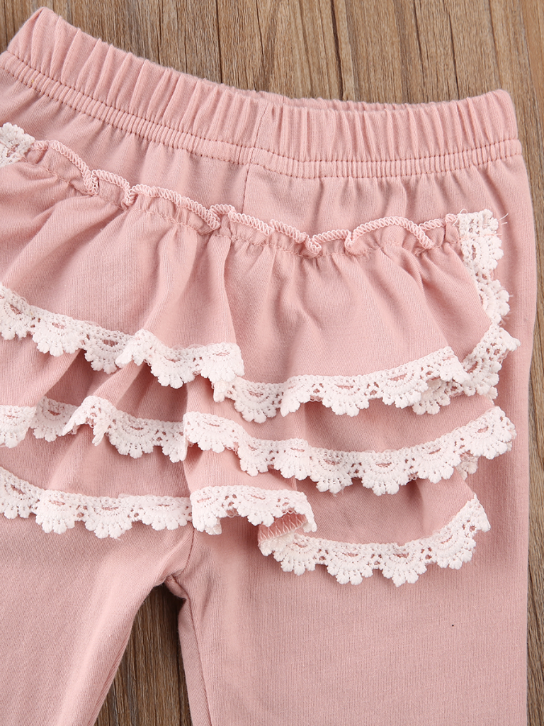 Baby set features a long-sleeved ruffled top and ruffled leggings