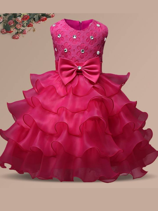 Baby princess dress has a floral lace bodice with rhinestone details, a bow belt at the waist, and a multi-layered tulle skirt-hot pink