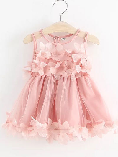 Baby  tulle dress has flower applique on the bodice and dress hem pink