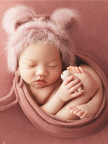 Baby set features a knitted shawl - wrap with a faux fur cap with ears and a little doll pink