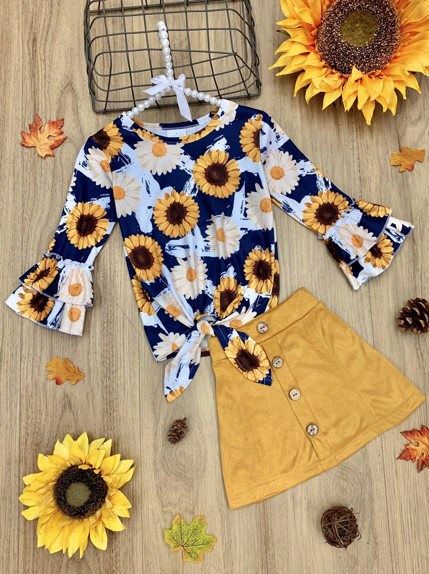 Little girls long-sleeve knot hem top with sunflower/daisy print, double ruffle cuffs, and a faux suede skirt with button applique - Mia Belle Girls