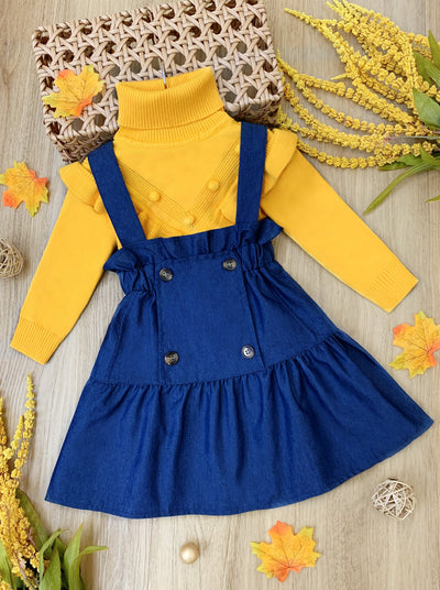 Little girls preppy chic long-sleeve triangle ruffle bib turtleneck sweater with pom-pom applique and a chambray overall skirt with ruffle details - Mia Belle Girls