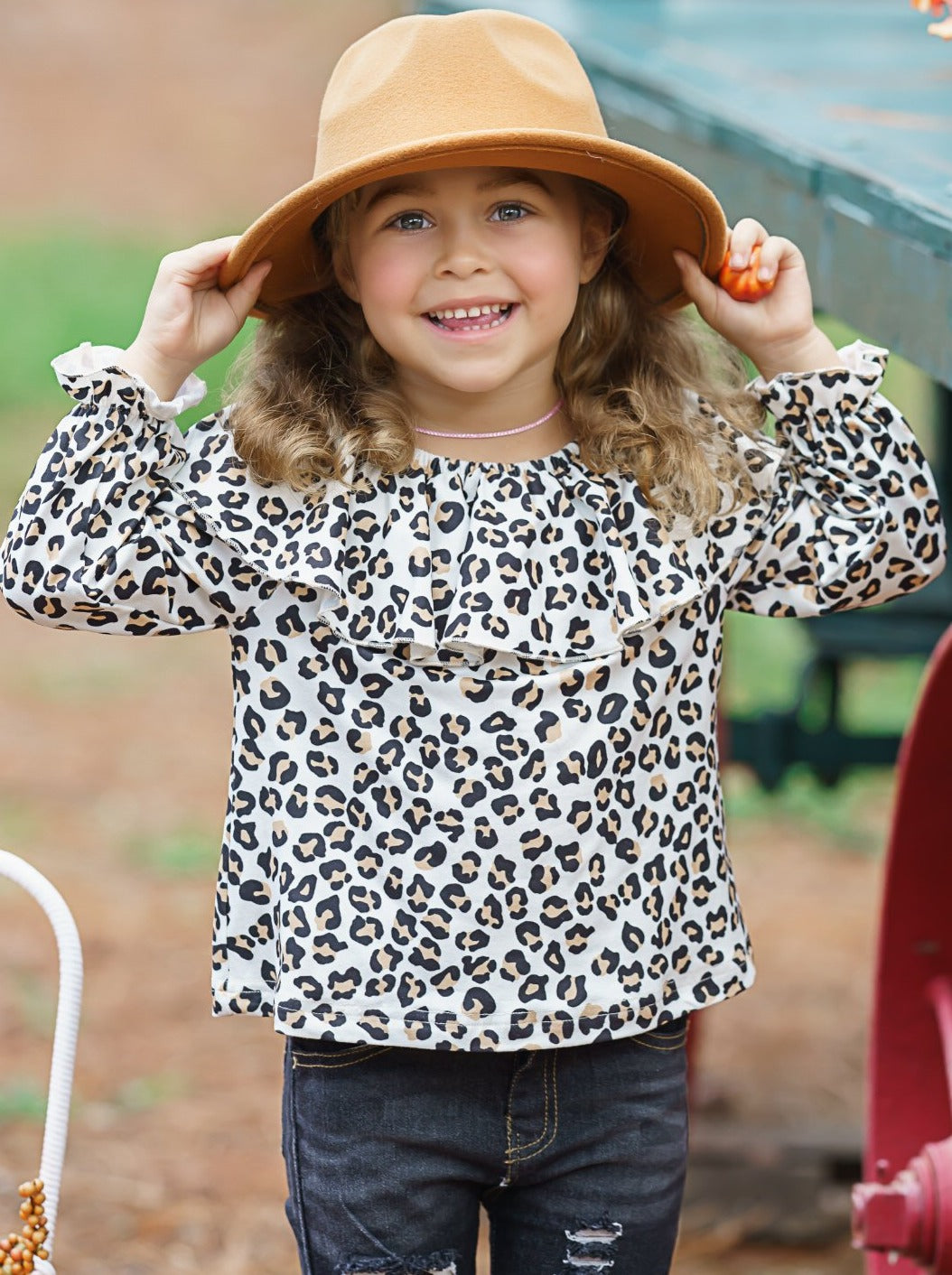 Girls set features a double ruffle neckline bib, animal printed top and patched jeans