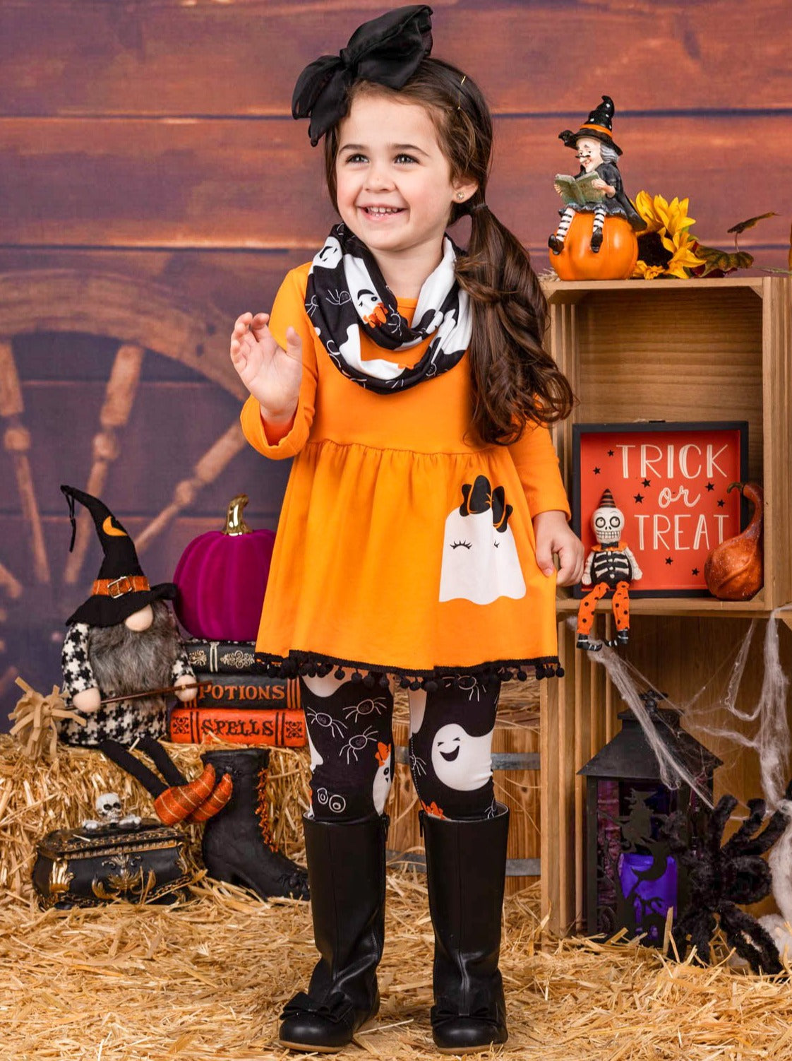 Little girls Halloween long-sleeve tunic with ghost graphic on the skirt, pom-pom, ghost print leggings, and matching infinity wrap scarf - Mia Belle Girls
