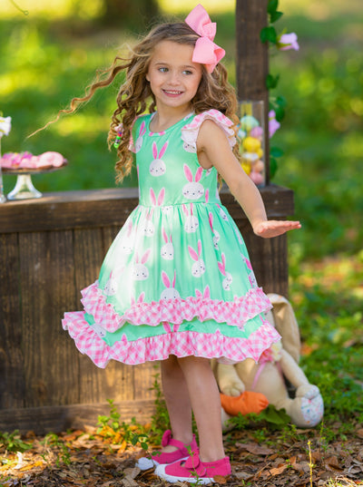 Girls Easter dress features a bunny print two-tiered design with Gingham flutter sleeves and hem