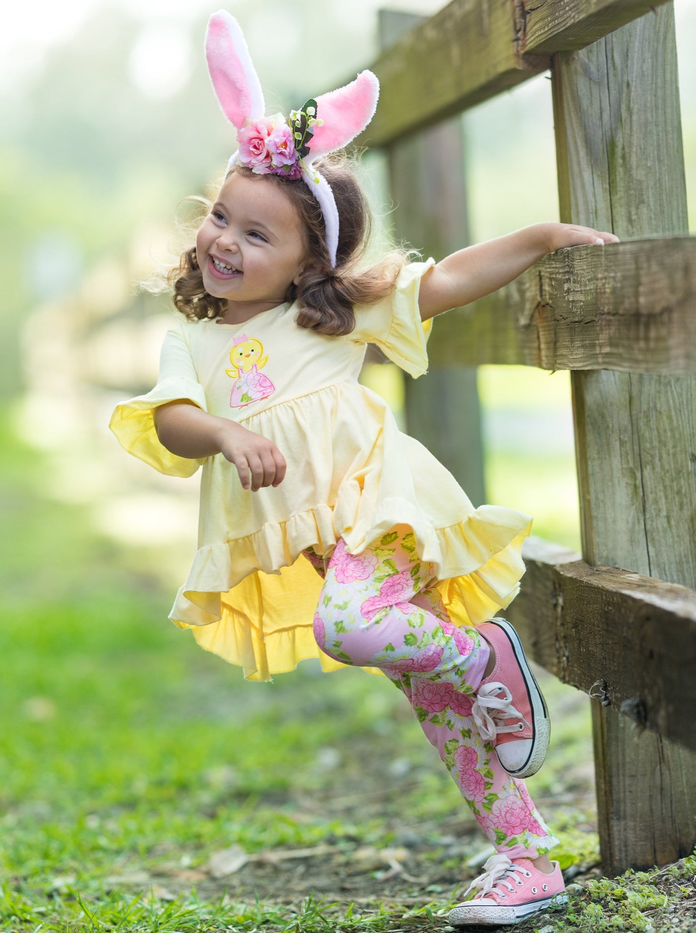 Girls Easter-themed set features ruffle sleeve hi-lo tunic and all-over floral or plaid print stretchy leggings for 2T to 10Y for toddlers and girls