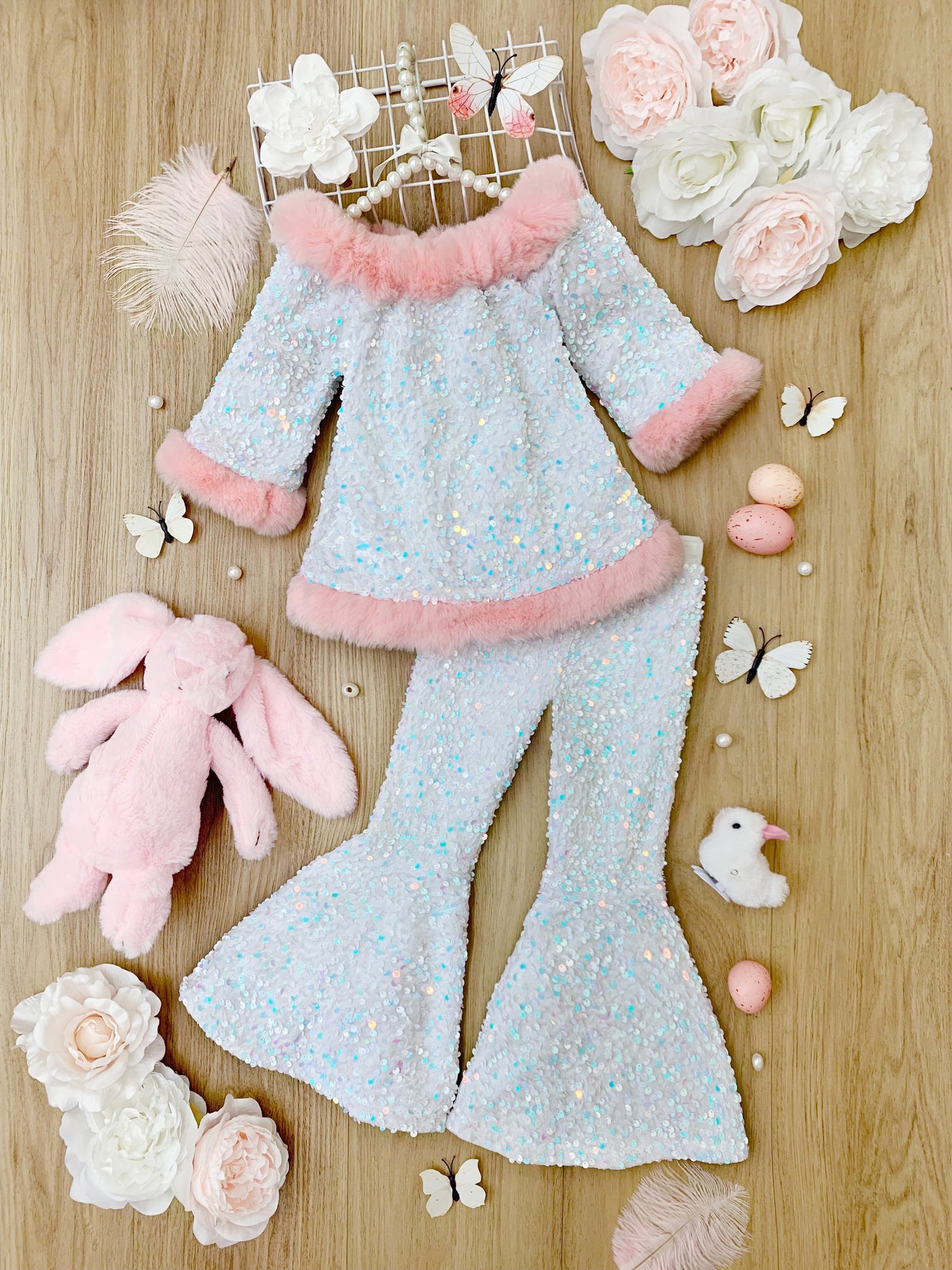 Girls sequin set features a short-sleeved top with faux fur trim and bell-bottom pants with a detachable faux fur cottontail. Lined to make it extra comfortable - Easter