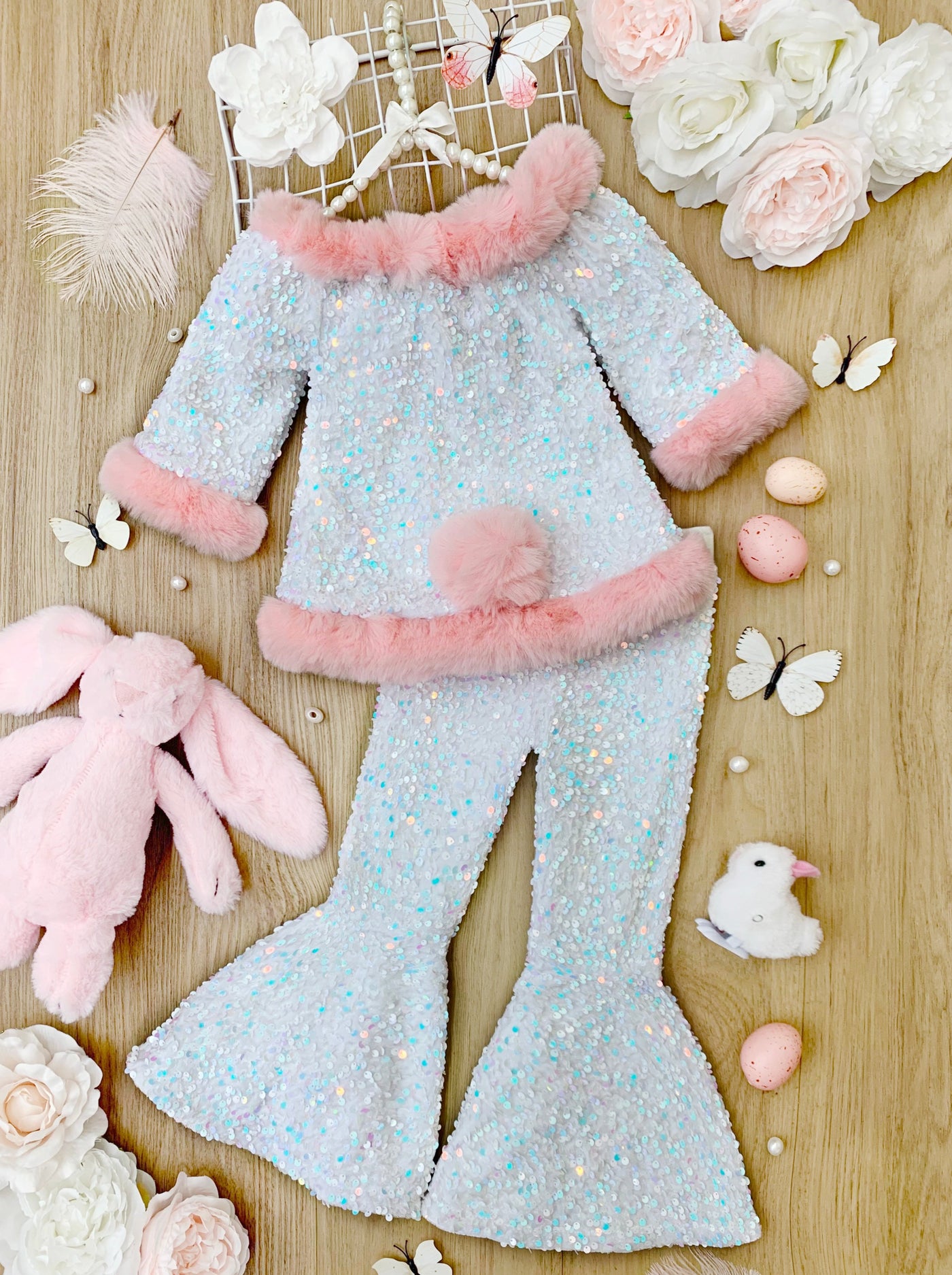 Girls sequin set features a short-sleeved top with faux fur trim and bell-bottom pants with a detachable faux fur cottontail. Lined to make it extra comfortable - Easter