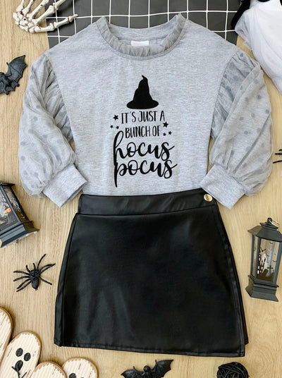 Girls Halloween apparel long-sleeve pullover sweater with swiss tulle sleeve overlay, tulle frill collar, "It's Just A Bunch Of Hocus Pocus" graphic, and vegan leather wrap style skirt - Mia Belle Girls