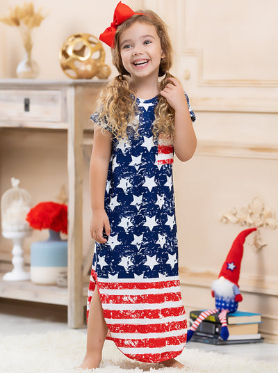 Mommy and me navy maxi dress features white stars and a red/white striped hem