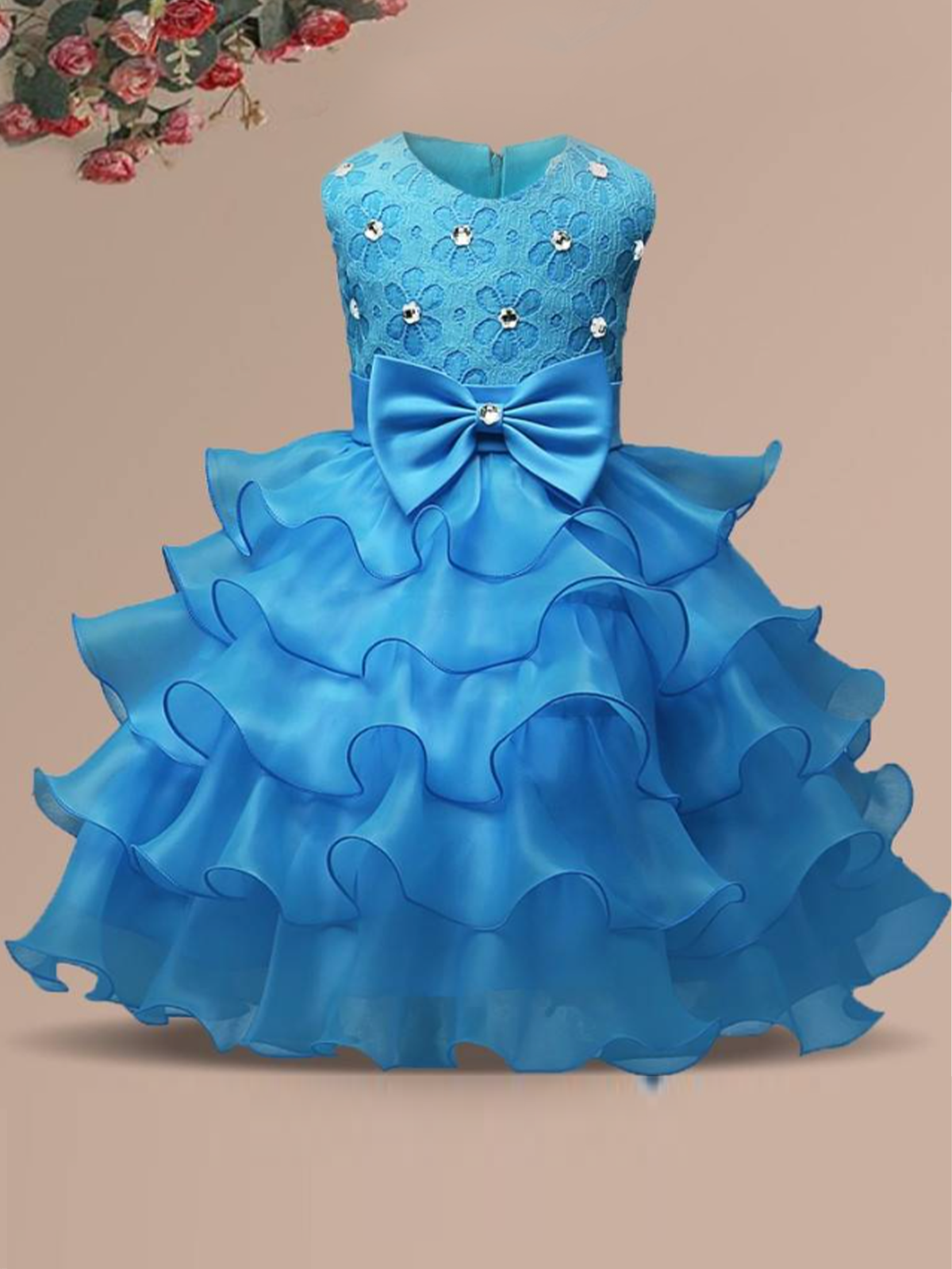 Baby princess dress has a floral lace bodice with rhinestone details, a bow belt at the waist, and a multi-layered tulle skirt-light blue